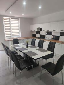 a dining room with a table and chairs at Agroturystyka Gorajec Zagroble in Wólka Czarnystok