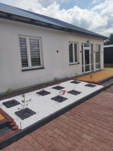 a house with a garden in front of it at Agroturystyka Gorajec Zagroble in Wólka Czarnystok