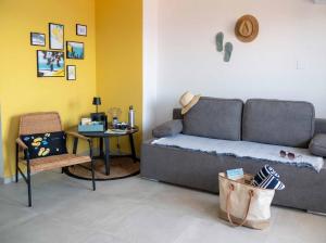 a living room with a couch and a table at holiday by the sea in Marusici 