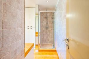 a bathroom with a shower and a walk in shower at Villa San Siro Olympic Stadium in Milan