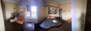 a bedroom with a bed and a window at AURa in Zhytomyr