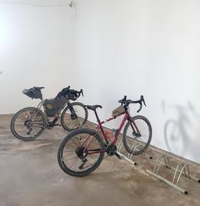 two bikes parked next to each other in a room at Guesthouse A Lareira in Aljezur