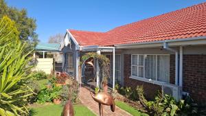 a brick house with a red roof at GerSan Oasis in Nigel