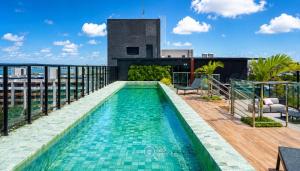 a swimming pool on the roof of a building at Emunah by 123Quarto in Camalaú