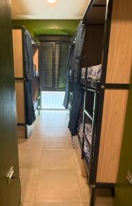 a corridor of a room with bunk beds and a hallway at Hostel BM19 in Madrid