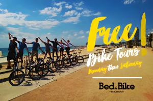 a group of people standing on a beach with their bikes at Bed & Bike Barcelona in Barcelona