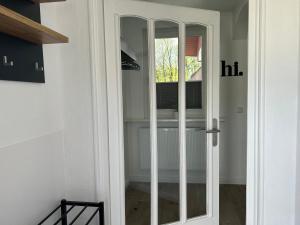 a sliding glass door in a room with a window at Ferienhaus Westend in Munster +60 photos
