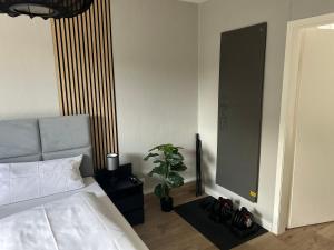 a bedroom with a bed and a large mirror at Ferienhaus Westend in Munster