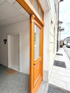 a wooden door on the side of a building at Street Apartment Rombon in Bovec