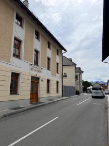 a building on the side of a street at Street Apartment Rombon in Bovec