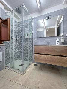 a bathroom with a shower and a sink at Il Silenzio del Mare in Gaeta +18 photos