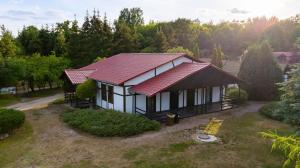 an overhead view of a house with a red roof at Star-Dadaj Lake Camp in Barczewo