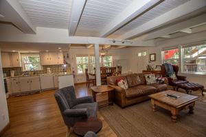 a living room with a couch and a table at Hillhouse By Hauserman Rentals in Homewood