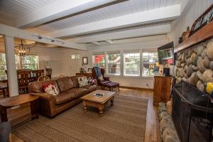 a living room with a couch and a table at Hillhouse By Hauserman Rentals in Homewood