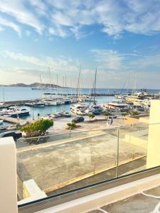 a view of a marina with boats in the water at Daphne in Naousa