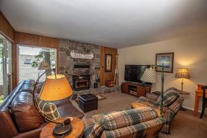 a living room with a couch and a fireplace at Holland By Hauserman Rentals in Homewood