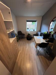 a living room with a table and a couch at Skibbild in Vildbjerg