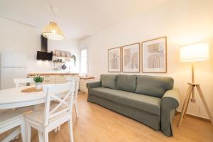 a living room with a couch and a table at Casa MaMi in Gatteo a Mare