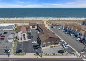 an aerial view of a parking lot next to the beach at Windswept Motel in Point Pleasant Beach