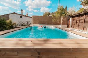 a swimming pool in the backyard of a house at DONNA LAURA - Holiday Home in Arezzo