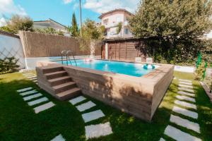 a swimming pool in the yard of a house at DONNA LAURA - Holiday Home in Arezzo