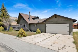 a brown house with a white garage at Big Bear Bungalow #643 in Big Bear City
