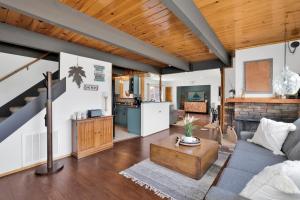 a living room with a couch and a table at Big Bear Bungalow #643 in Big Bear City