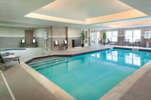 a large pool with blue water in a hotel room at Residence Inn by Marriott Toronto Markham in Markham
