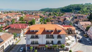 an overhead view of a town with an orange roof at Sub Cetate in Râşnov