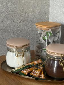 a tray with two jars of honey and a bag of food at Loftas Smilga in Palanga +9 photos