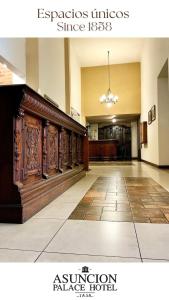 an empty lobby with a large wooden buffet in a building at Asuncion Palace in Asunción