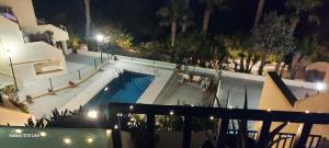 an overhead view of a swimming pool at night at Reka Casa in Mojácar