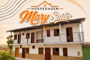 a building with a sign that reads may smiles at Mary Suítes in Lençóis +7 photos