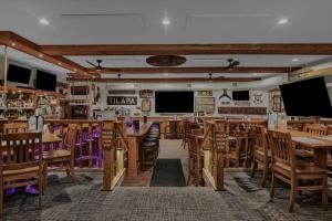 a dining room with wooden tables and chairs at Lamies Inn & The Old Salt Tavern in Hampton