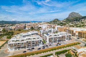 an aerial view of a city with buildings and mountains at Casa Costa Xàbia in Jávea