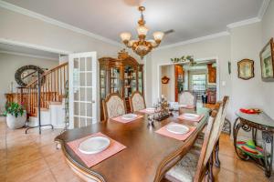 a dining room with a wooden table and chairs at Red Oak Group Getaway w/ Yard + Patio in Red Oak