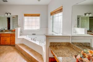 a large bathroom with a tub and a sink at Red Oak Group Getaway w/ Yard + Patio in Red Oak +31 photos