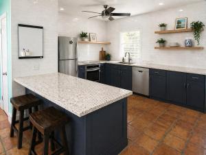 a kitchen with a large island with a counter top at East End Escape in Christiansted
