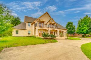 a large house with a balcony on a driveway at Red Oak Group Getaway w/ Yard + Patio in Red Oak