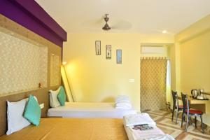 a hotel room with a bed and a table at HOTEL SHREESH (NEIL) in Neil Island +288 photos