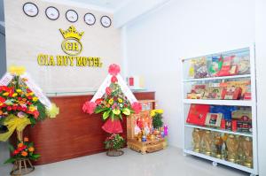 a toy store with a christmas tree and a sign at Gia Huy Guesthouse in Da Nang