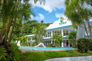 a resort with a swimming pool and palm trees at Hotel Playa Azul in Catemaco