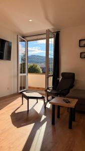 a living room with a couch and a table at Apartmány Pod Stráží in Sušice