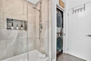 a bathroom with a shower and a toilet at La Trêve Mont Tremblant in La Conception +21 photos