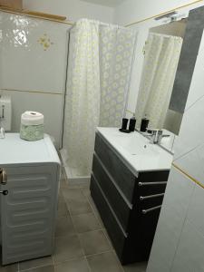 a bathroom with two sinks and a mirror at Nonna Lidie in Aymavilles +17 photos