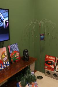 a room with a green wall with a floor lamp at Krabi Buddy House in Ban Khlong Chi Lat +10 photos