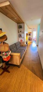 a living room with a couch and a wooden floor at Spacious 4BR Duplex with Pool in Punta Hermosa in Punta Hermosa