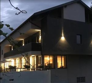 a large house with lights on the side of it at HOTEL Monte Cimone in Caldonazzo