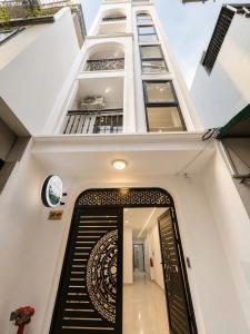 a stairway leading up to a building with a staircase at Dreamora Serenity Hotel & Residence in Hanoi