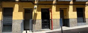 a building with three doors on the side of it at Hostel BM19 in Madrid